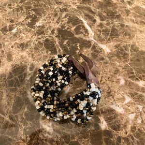 Bracelets-white, black and gold beads-the other blue, gold and white beads.